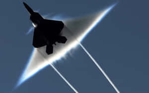 A U.s. Air Force F-22 Raptor Performs Aerial Acrobatics During An Airshow Wallpaper