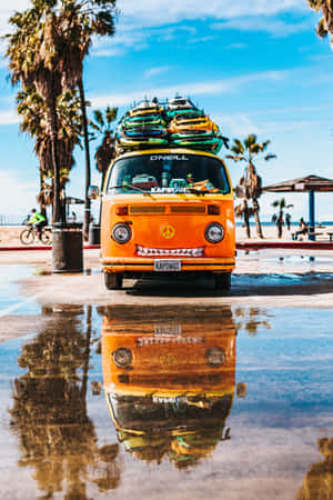 A Van With Surfboards On Top Wallpaper