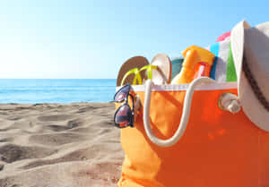 A Vibrant Beach Bag On Sunny Shore Wallpaper