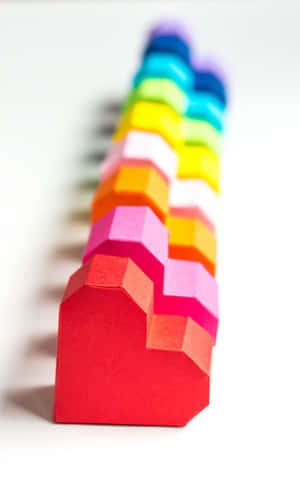 A Vibrant Blue And Green Vines Encircled By A Yellow, White And Green Wreath Wallpaper