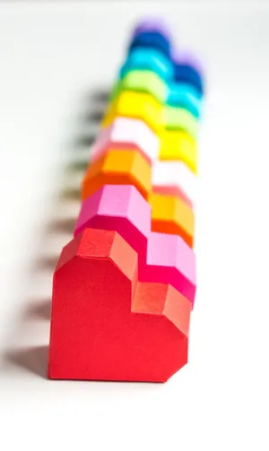 A Vibrant Blue And Green Vines Encircled By A Yellow, White And Green Wreath Wallpaper