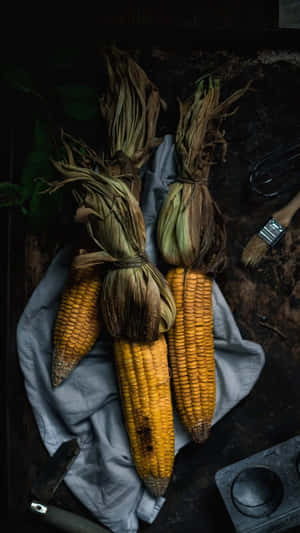 A Vibrant Close-up Photograph Of Yellow Corn On The Cob Wallpaper