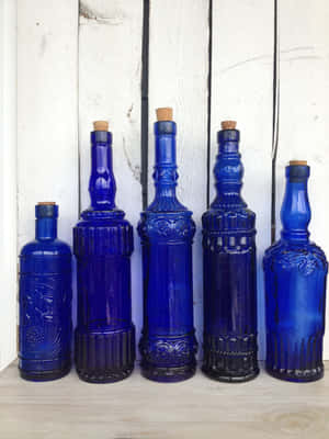 A Vibrant Cobalt Blue Sky Above A Vast Lake Wallpaper