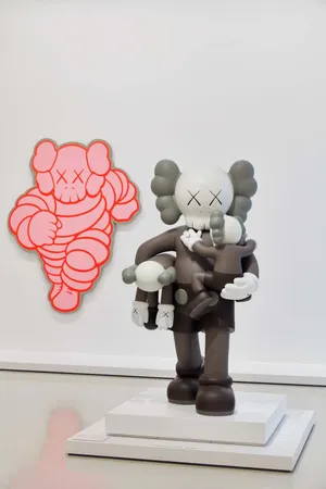 A Vibrant Collection Of Kaws Figures On Display Wallpaper