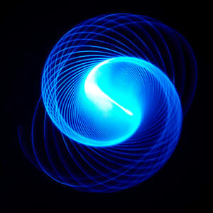 A Vibrant Electric Blue Gradient Against A Textured Backdrop Wallpaper