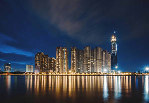 A View Of A Bustling City At Night Wallpaper