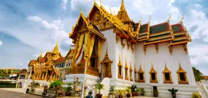 A View Of Sunrise Over A Mountain Range Wallpaper