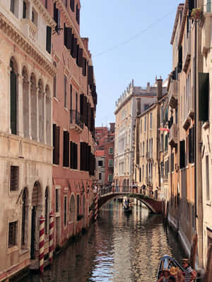 A View Of The Colorful Streets Of Venice, Italy Wallpaper