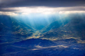 A View Of The Mountains From An Airplane Wallpaper