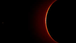 A View Of The Sun With A Red Ring Around It Wallpaper