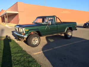 A Vintage Jeep Comanche In A Picturesque Off-road Setting Wallpaper