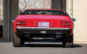 A Vintage Lamborghini Urraco On Scenic Road Wallpaper