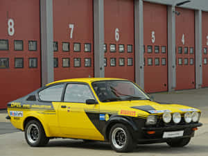 A Vintage Opel Kadett, Perfect Blend Of Classic Elegance And Mechanical Precision Wallpaper