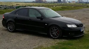 A Vintage Saab 99 Sedan Parked On The Street Wallpaper