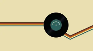 A Vinyl Record With A Colorful Background Wallpaper