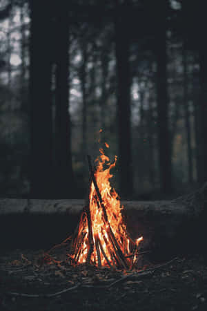 A Warm And Inviting Cozy Fire In A Rustic Fireplace Wallpaper