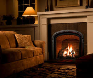 A Warm And Inviting Fireplace With Glowing Fire Wallpaper