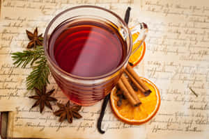 A Warm And Inviting Glass Of Mulled Wine For The Holiday Season Wallpaper