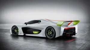 A White And Green Racing Car In A Dark Room Wallpaper