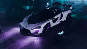 A White And Purple Sports Car Is Parked In A Dark Parking Lot Wallpaper