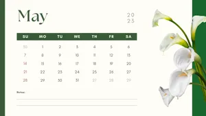 A White Calendar With Flowers On It Wallpaper