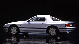 A White Car In A Dark Room Wallpaper