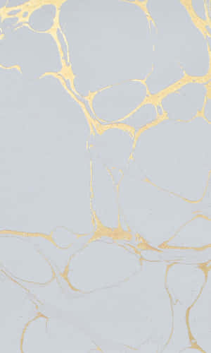 A White Marble With Gold And Silver Paint Wallpaper