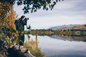 A Woman Admiring The Lake View Wallpaper