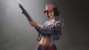 A Woman Holding A Gun In A Dark Room Wallpaper