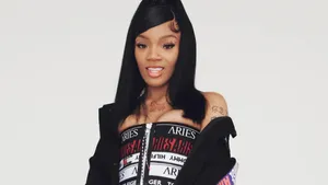 A Woman In A Black Top And Hoodie Wallpaper