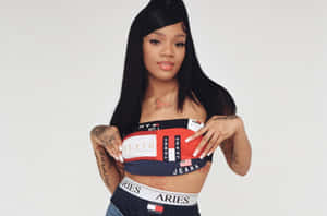 A Woman In A Bra Top And Jeans Posing Wallpaper