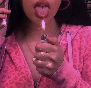 A Woman Is Holding A Lighter Wallpaper