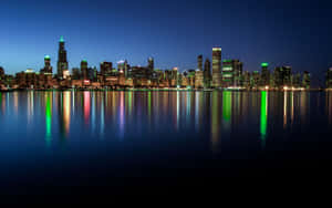 A Woman Looking Out Of A Window With A View Of A City's Night Skyline Wallpaper