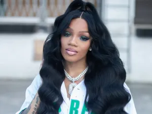 A Woman Wearing A Black Shirt And A Black Wig Wallpaper