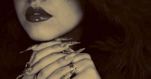 A Woman With A Fur Coat And A Ring On Her Finger Wallpaper