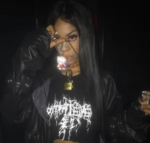 A Woman With Long Hair And A Black Jacket Wallpaper