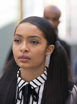A Woman With Long Hair And A Striped Shirt Wallpaper