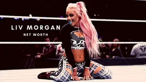 A Woman With Pink Hair Sitting On The Ground Wallpaper