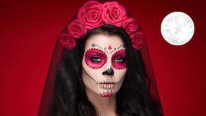 A Woman With Sugar Skull Makeup And Roses On Her Face Wallpaper