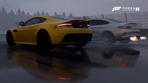 A Yellow Aston Db9 And A Yellow Aston Db9 Wallpaper