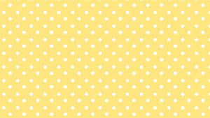 A Yellow Polka Dot Background With White Dots Wallpaper