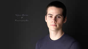 A Young Man Is Posing For A Photo Wallpaper