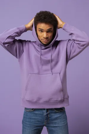 A Young Woman Wearing A Stylish Purple Hoodie. Wallpaper