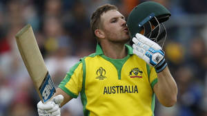 Aaron Finch Kissing His Helmet Wallpaper