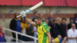 Aaron Finch Raising His Cricket Bat Wallpaper