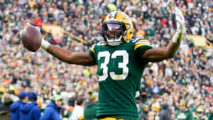 Aaron Jones Of The Green Bay Packers On The Move Wallpaper