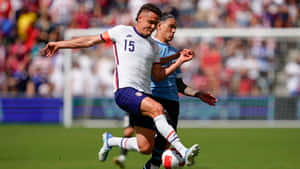 Aaron Long, An American Athlete, In Action During A 2022 Friendly Match. Wallpaper