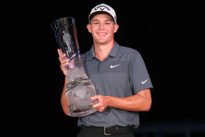 Aaron Wise Holding A Trophy Wallpaper