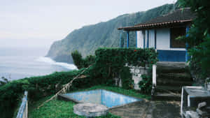 Abandoned Pool By Ocean Cliff Wallpaper