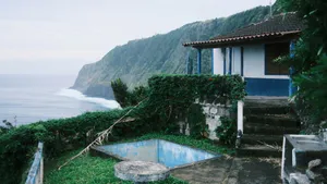 Abandoned Pool By Ocean Cliff Wallpaper
